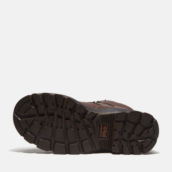 The sole of the right boot on a Timberland TiTAN EV Met Guard composite toe women's 6-inch work boots in brown with a blank background.