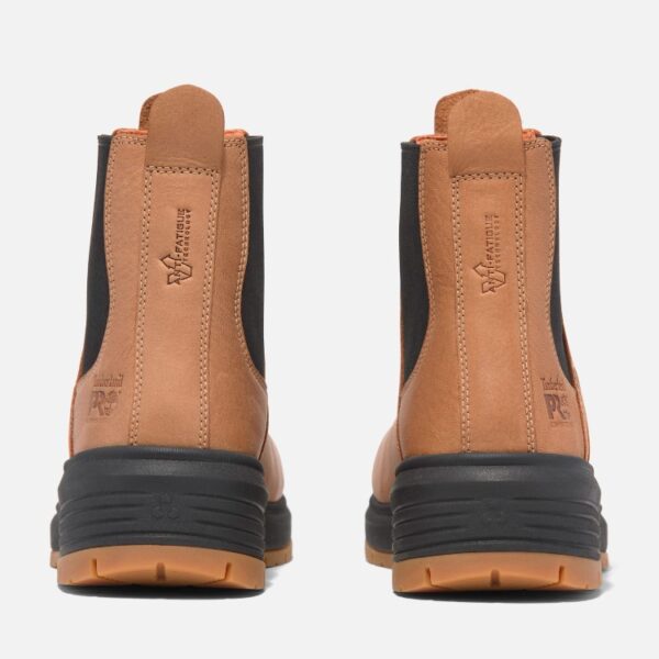 A look at the heels of a pair of Timberland PRO Birchline composite toe 6-inch women's pull-on work boots in tan with a blank background.