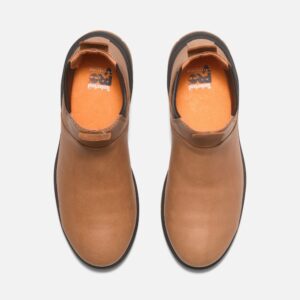 Overhead look at a pair of Timberland PRO Birchline composite toe 6-inch women's pull-on work boots in tan on a blank background.