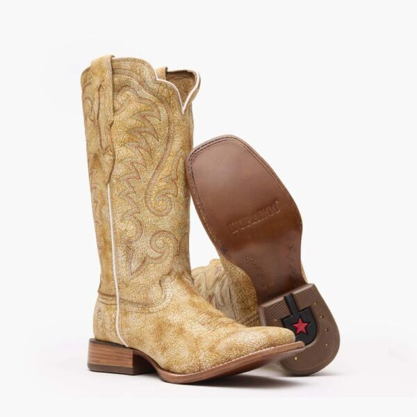 A 3/4 turned pair showing off the sole of a Durango Arena Pro Women's Cremello Western Boot.