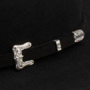 A closeup look at the hatband on a Resistol 20X Black Gold 72 Profile Cowboy Hat.
