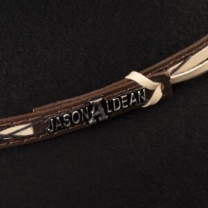 A closeup look at the hatband on a Resistol 4X Amarillo Sky Black - Jason Aldean Cowboy Hat.