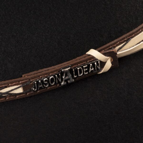 A closeup look at the hatband on a Resistol 4X Amarillo Sky Black - Jason Aldean Cowboy Hat.