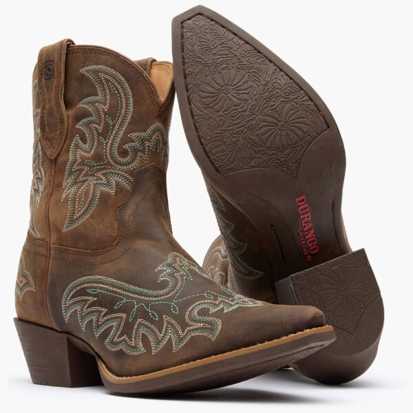 A 3/4 turned pair showing off the sole of a Durango Women's Shyloh Driftwood Pony Boot.