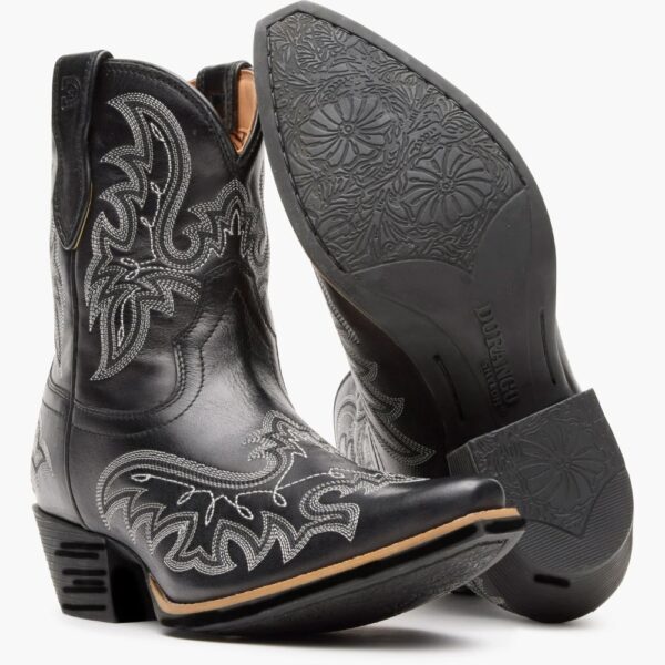 A 3/4 turned pair showing off the sole of a Durango Women's Shyloh Polished Black Onyx Pony Boot.