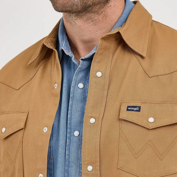 A closeup look at chest pocket on a Wrangler Long Sleeve Flannel Lined Solid Work Shirt.