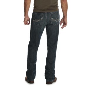 A modeled, rear-facing look at a pair of Wrangler Men's 20X No. 42 Vintage Bootcut Jeans.