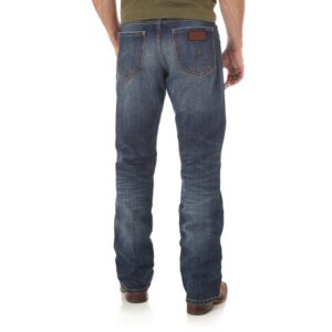 A modeled, rear-facing look at a pair of Wrangler Men's Retro Relaxed Fit Bootcut Jeans.