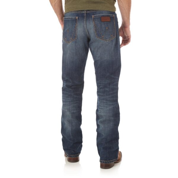 A modeled, rear-facing look at a pair of Wrangler Men's Retro Relaxed Fit Bootcut Jeans.