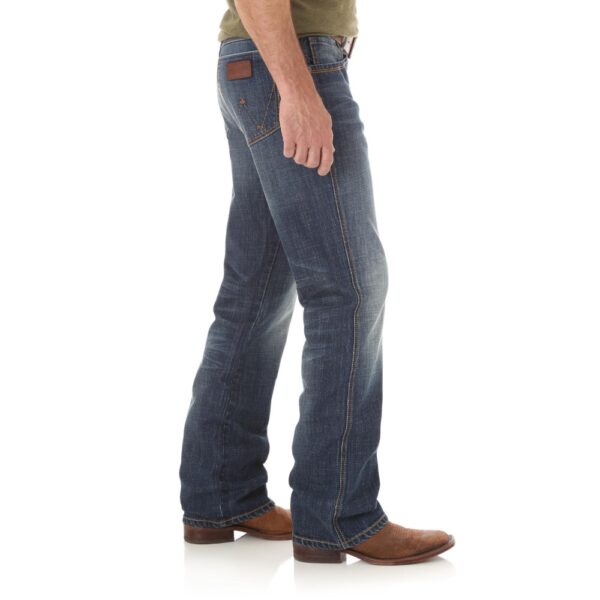 A modeled, right-side-facing look at a pair of Wrangler Men's Retro Relaxed Fit Bootcut Jeans.