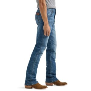A modeled, side-facing look at a pair of Wrangler Men's Retro Slim Bootcut Jeans.