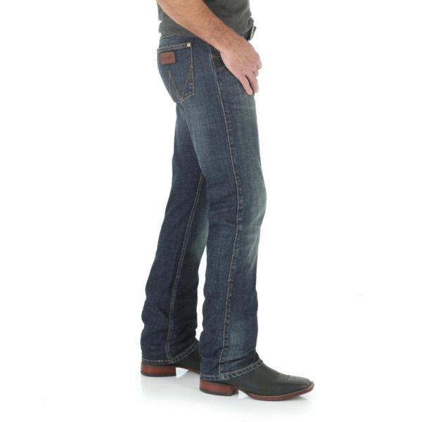 A modeled, right-side-facing look at a pair of Wrangler Men's Retro Slim Fit Straight Leg Jeans.