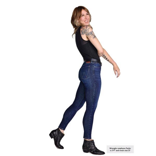A modeled, right-side-facing look at a pair of Wrangler Women's Bespoke High Rise Skinny Jeans.