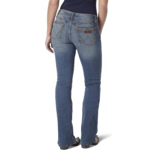 A modeled, rear-facing look at a pair of Wrangler Women's Retro Mae Mid-Rise Bootcut Jeans.