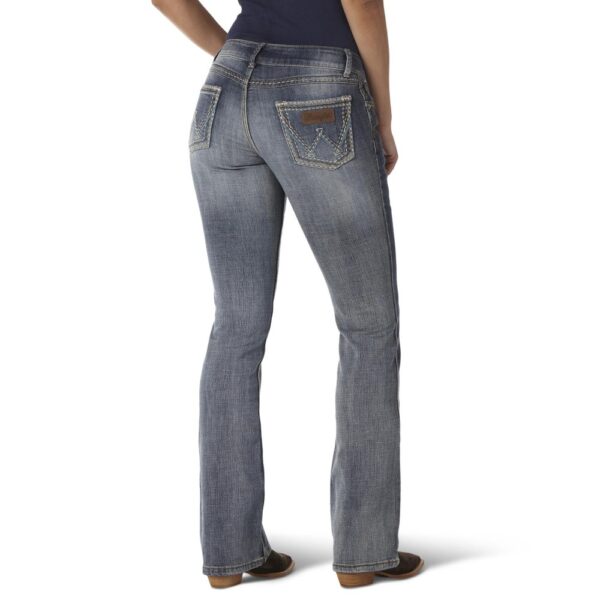 A modeled, rear-facing look at a pair of Wrangler Women's Retro Sadie Bootcut Jeans.