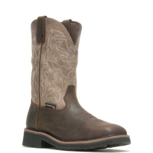 A 3/4 right turned Wolverine Rancher Waterproof Steel Toe Wellington Pull-On Work Boot.